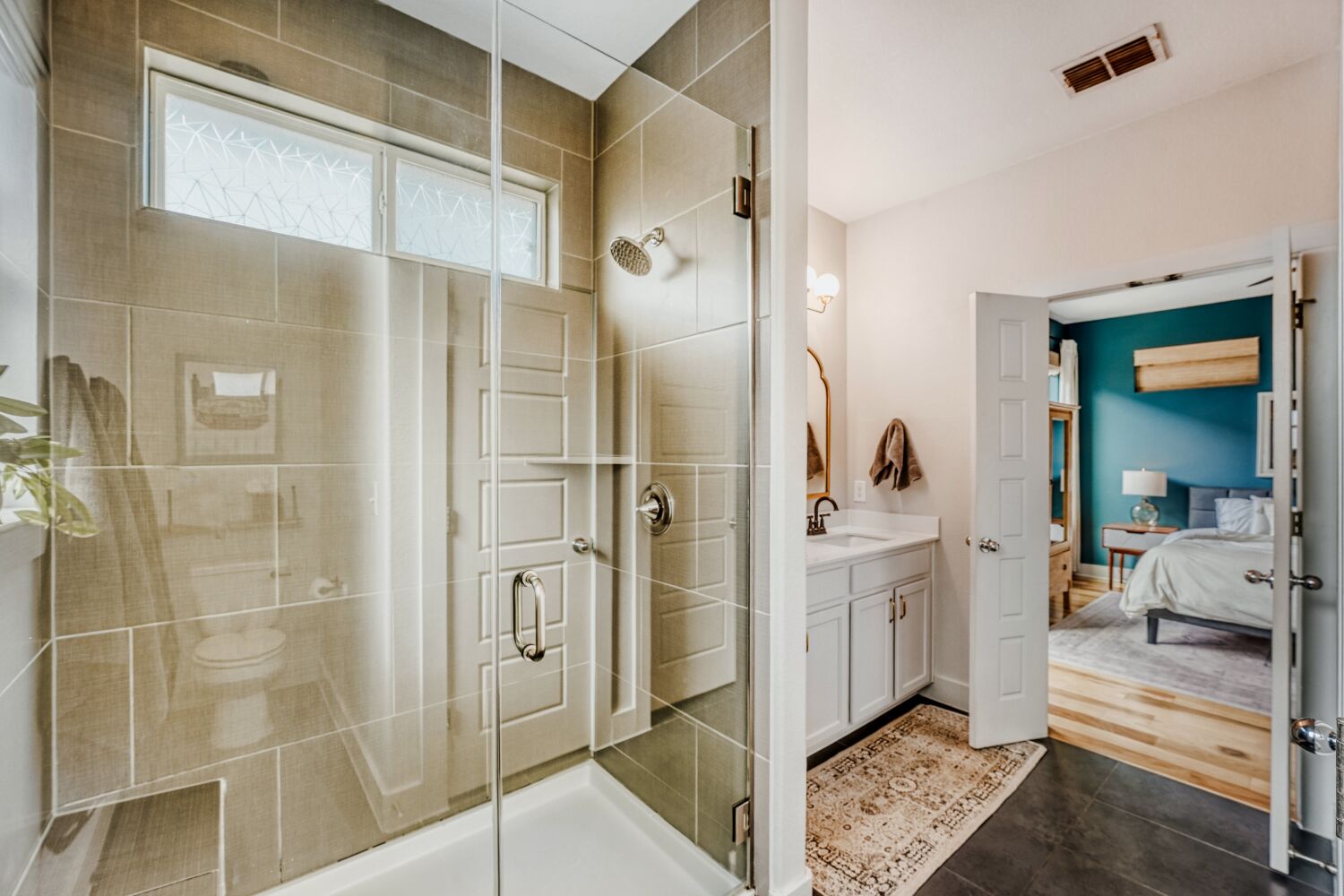 2000 Hermia Street Austin, TX 78741 - Photo 15 of 28 Full bathroom with ensuite bath, a stall shower, and vanity