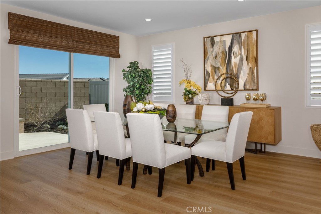 9028 Carson Avenue Hesperia, CA 92344 - Photo 4 of 11 a view of a dining room with furniture window and wooden floor