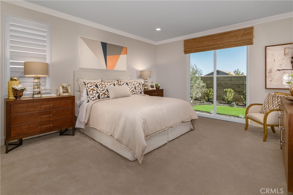 9028 Carson Avenue Hesperia, CA 92344 - Photo 5 of 11 a bedroom with a bed and a couch
