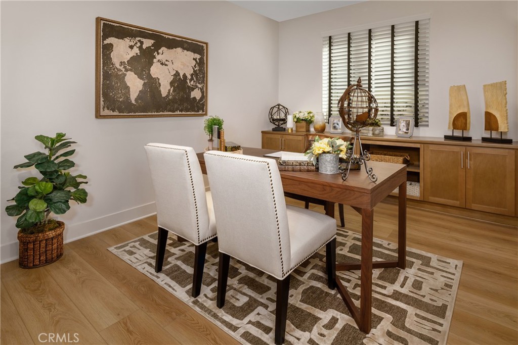 9028 Carson Avenue Hesperia, CA 92344 - Photo 8 of 11 a view of a dining room with furniture window and wooden floor