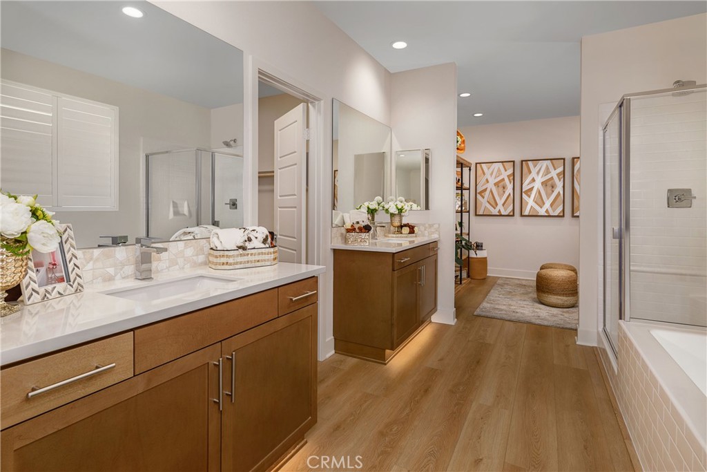 9028 Carson Avenue Hesperia, CA 92344 - Photo 10 of 11 a spacious bathroom with a sink a mirror a bathtub and shower
