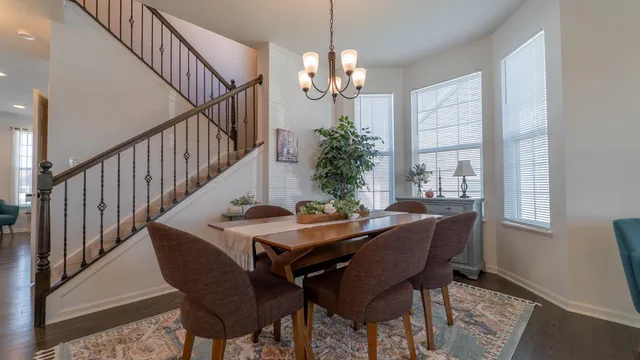a view of a dining room with furniture and window