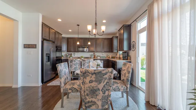 a view of a dining area with furniture window and wooden floor
