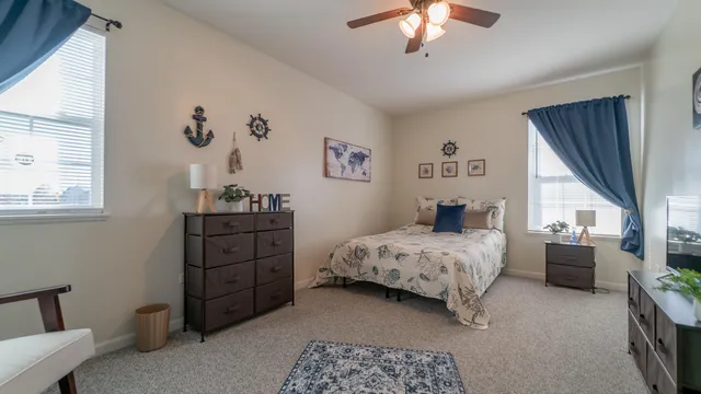 a bed room with a bed and a chandelier