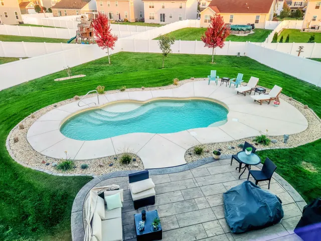 a view of a table and chairs in the garden