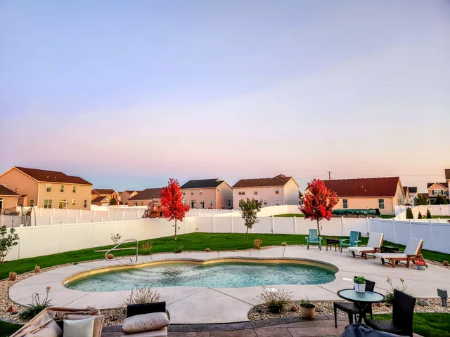 an aerial view of a house with outdoor space