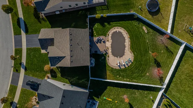 an aerial view of a house with a garden