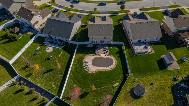 an aerial view of a house with a swimming pool