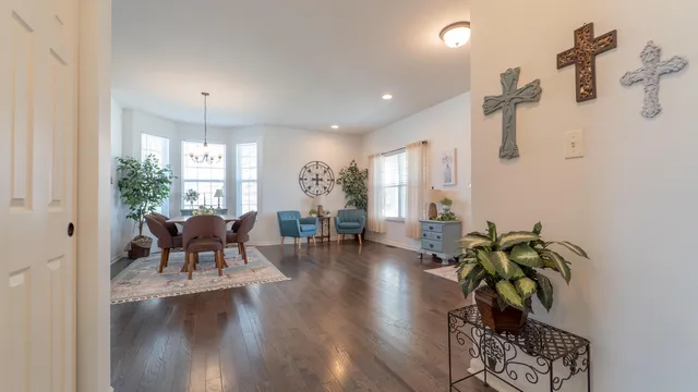 a living room with furniture window and wooden floor