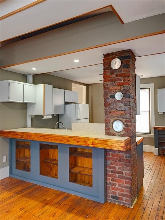 910 Page Street McKees Rocks, PA 15136 - Photo 12 of 25 a kitchen with stainless steel appliances granite countertop a stove a sink and a refrigerator