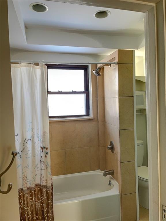 910 Page Street McKees Rocks, PA 15136 - Photo 17 of 25 a bathroom with a bathtub a shower and a shower