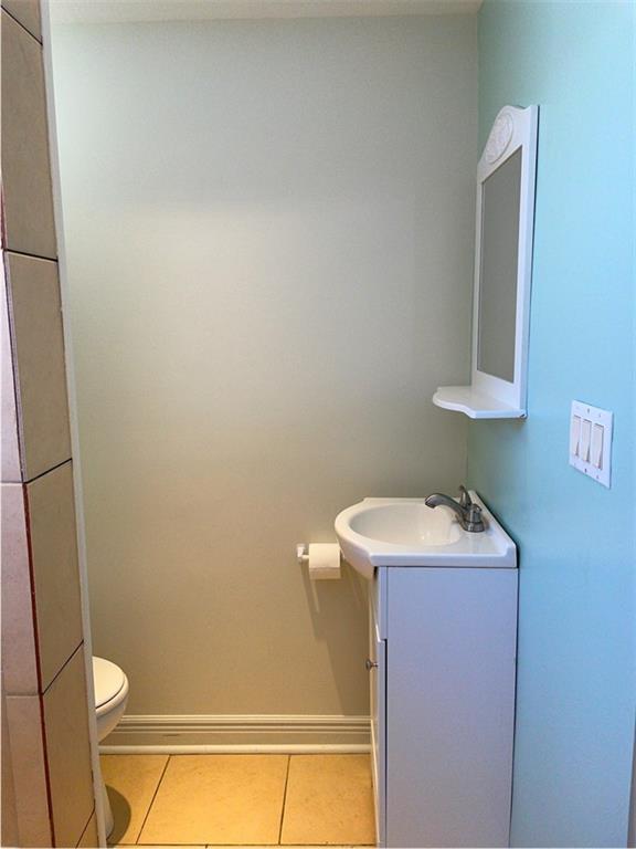 910 Page Street McKees Rocks, PA 15136 - Photo 18 of 25 a bathroom with a sink a toilet and a mirror