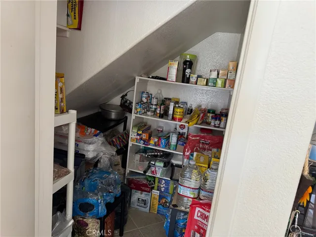 a room with lots of books and storage