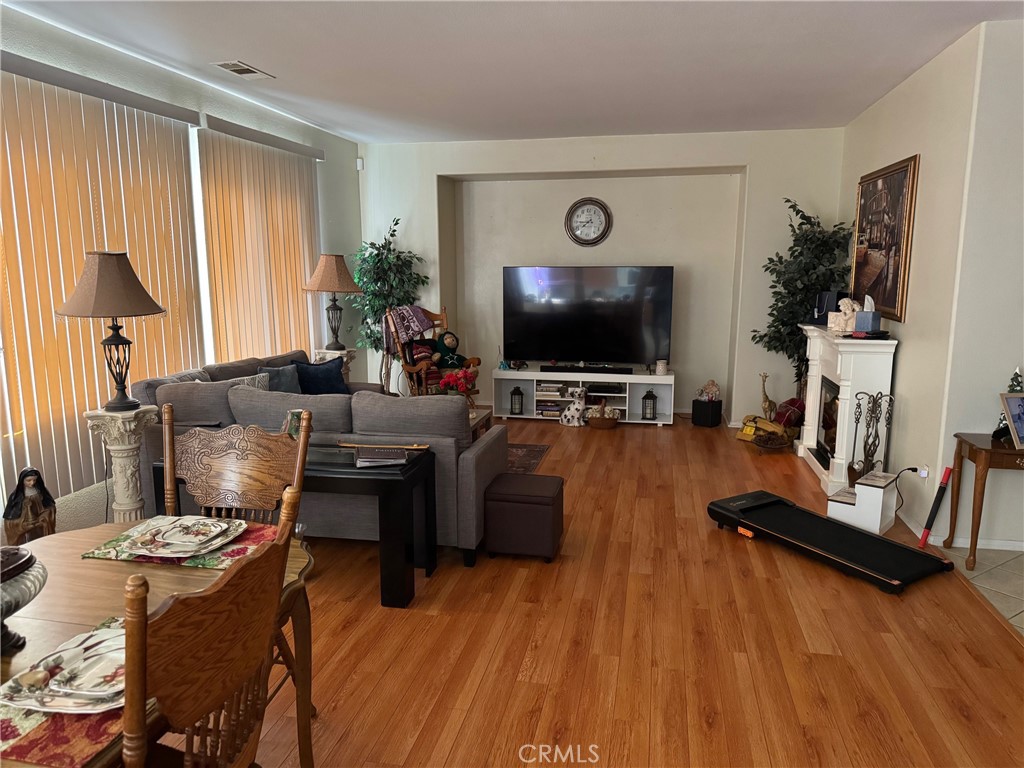 1338 Smoke Tree Lane Beaumont, CA 92223 - Photo 3 of 15 a living room with furniture and a flat screen tv