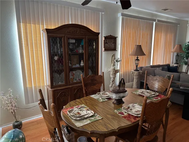 a dining room with furniture and window