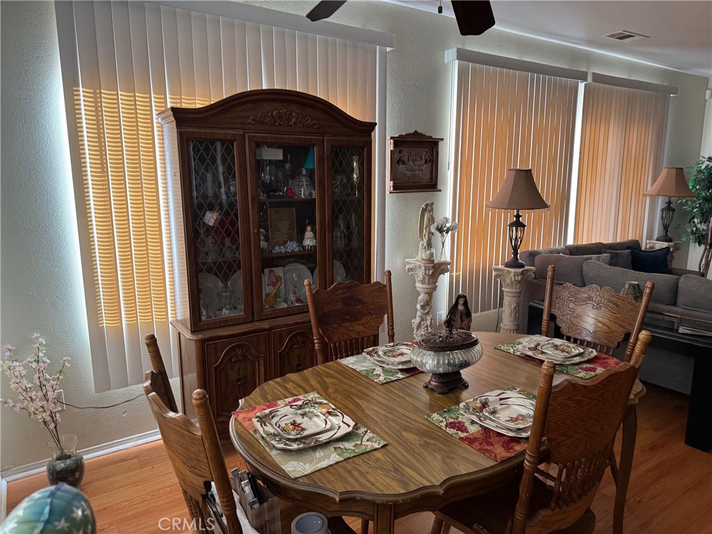 1338 Smoke Tree Lane Beaumont, CA 92223 - Photo 4 of 15 a dining room with furniture and window
