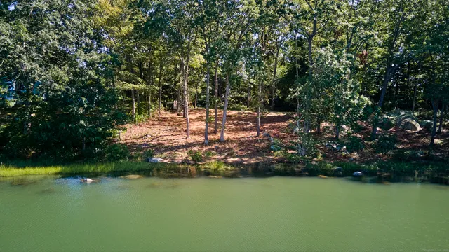 a front view of a multi story building with yard