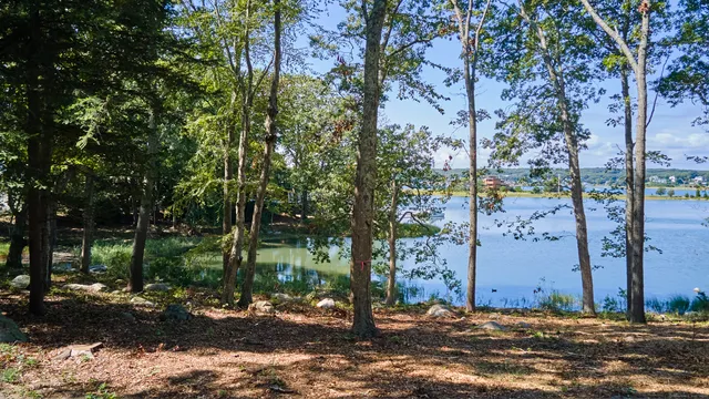a view of a lake with a yard