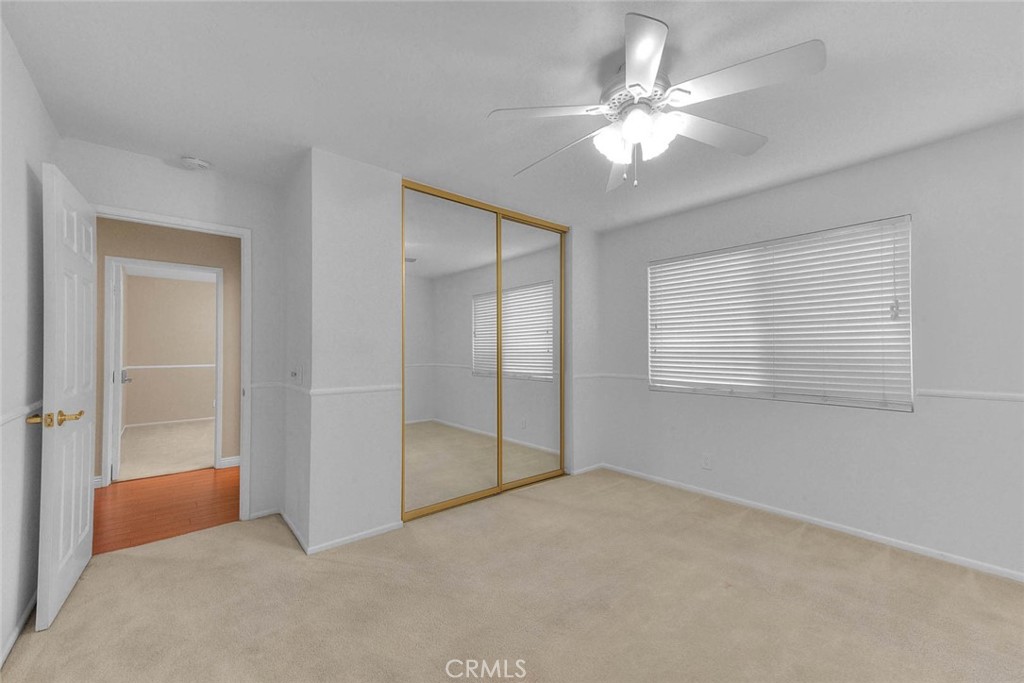 30673 Del Rey Road Temecula, CA 92591 - Photo 26 of 47 Spacious Bedroom Two With Mirrored Closet Doors. Closet Has Both Selves And Drawered Cabinets