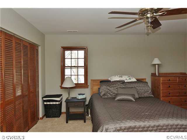 2919 Shiloh Church Road Midlothian, VA 23112 - Photo 17 of 24 a bedroom with a bed and a table