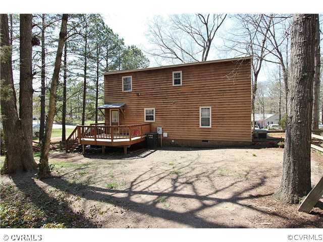 2919 Shiloh Church Road Midlothian, VA 23112 - Photo 23 of 24 a view of a house with a yard covered in snow