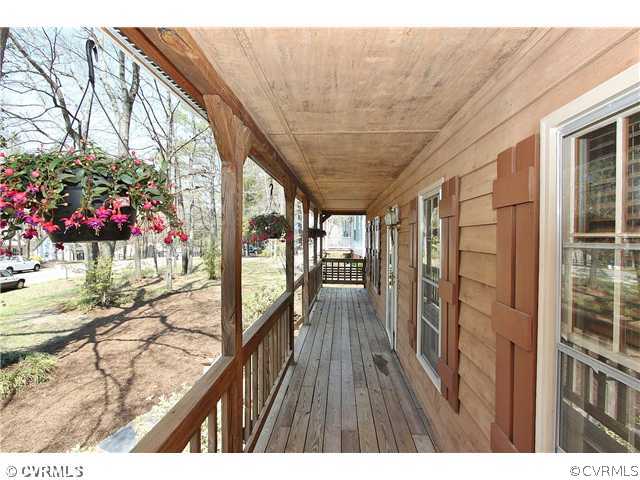2919 Shiloh Church Road Midlothian, VA 23112 - Photo 4 of 24 a view of a porch and wooden floor