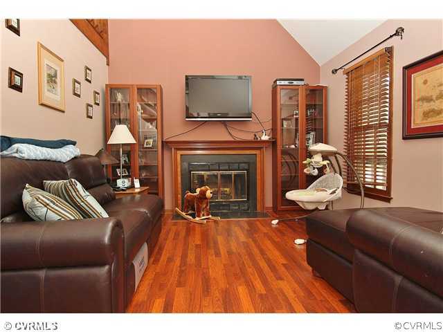 2919 Shiloh Church Road Midlothian, VA 23112 - Photo 6 of 24 a living room with furniture and a fireplace