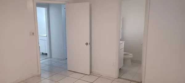 a bathroom with a granite countertop window