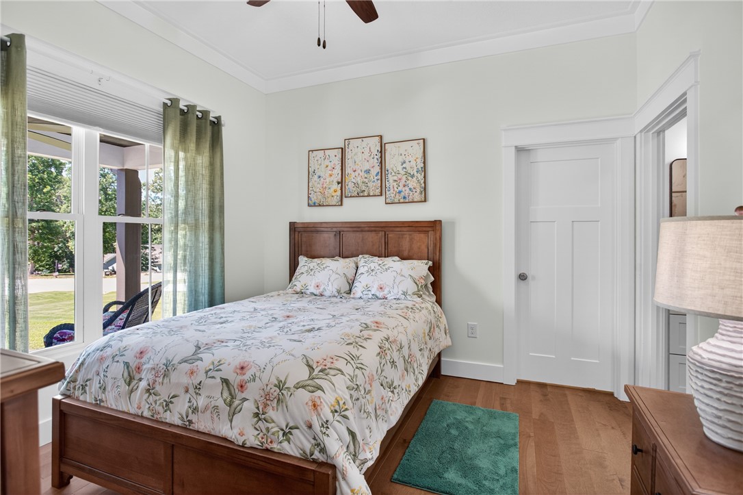 921 Falling Waters Lane Seneca, SC 29672 - Photo 5 of 46 Hardwood flooring and abundant natural light create a welcoming and comfortable bedroom.