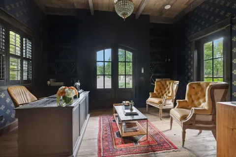 a view of a hallway with wooden door