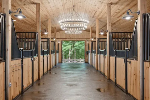 a view of a patio with table and chairs potted plants with wooden floor and fence