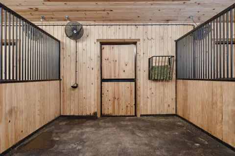 a view of patio with a table and chairs and potted plants