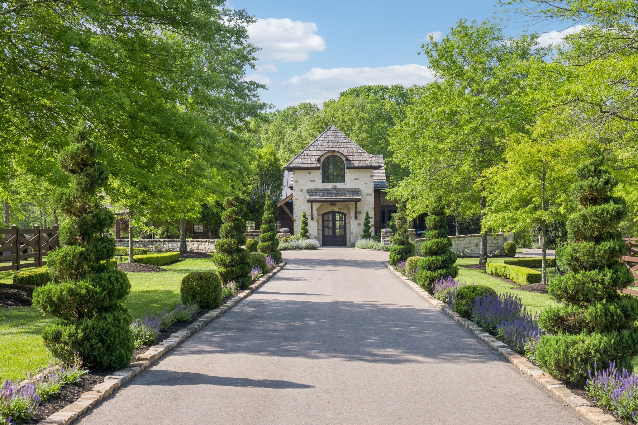 5715 Greenbrier Road Franklin, TN 37064 - Photo 3 of 72 a front view of a house with a garden and fountain