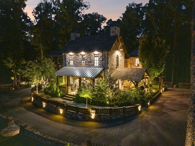 a living room with a large window and a table