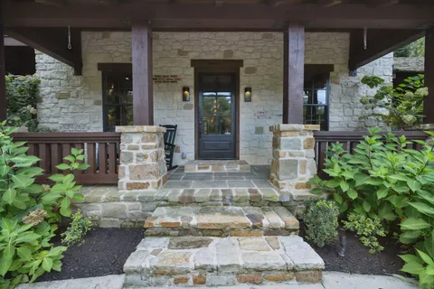 a view of a patio with dining table and chairs with wooden floor