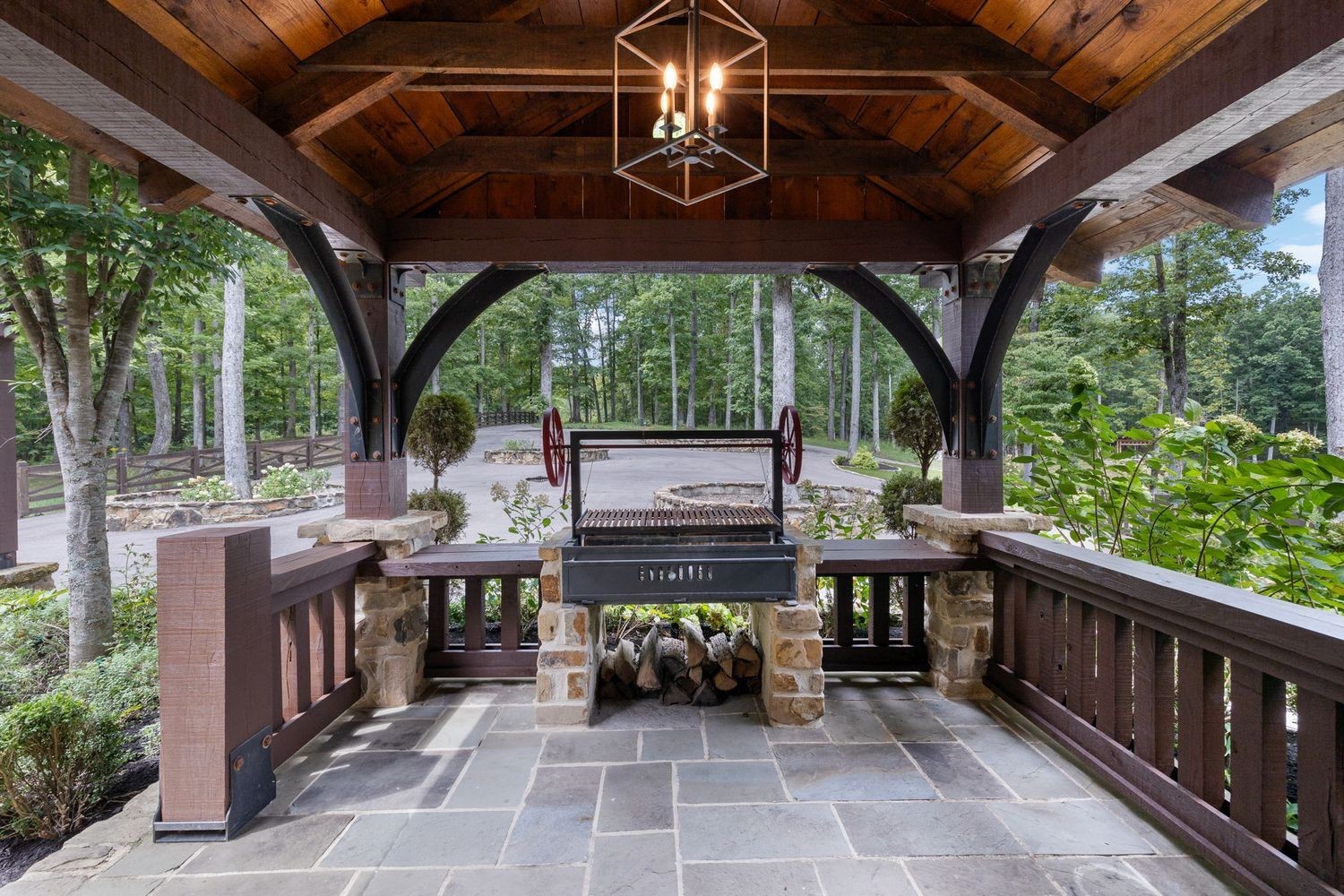 5715 Greenbrier Road Franklin, TN 37064 - Photo 38 of 72 a view of a patio with table and chairs potted plants with wooden floor and fence