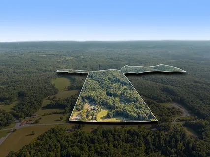 an aerial view of a house with mountain view
