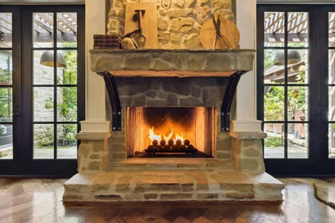 a view of a porch with chairs and backyard