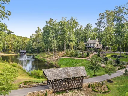 a view of a patio with dining table and chairs