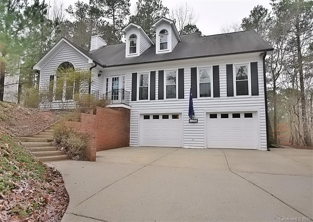 11068 Deep Cove Drive Tega Cay, SC 29708 - Photo 2 of 34 a front view of a house with a garden