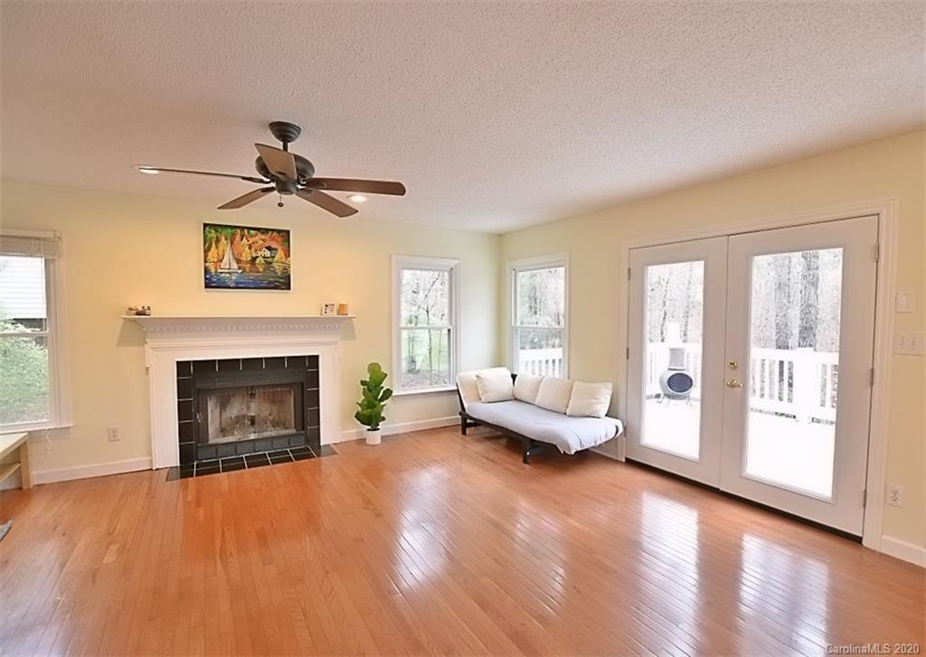 11068 Deep Cove Drive Tega Cay, SC 29708 - Photo 12 of 34 a living room with furniture and a fireplace