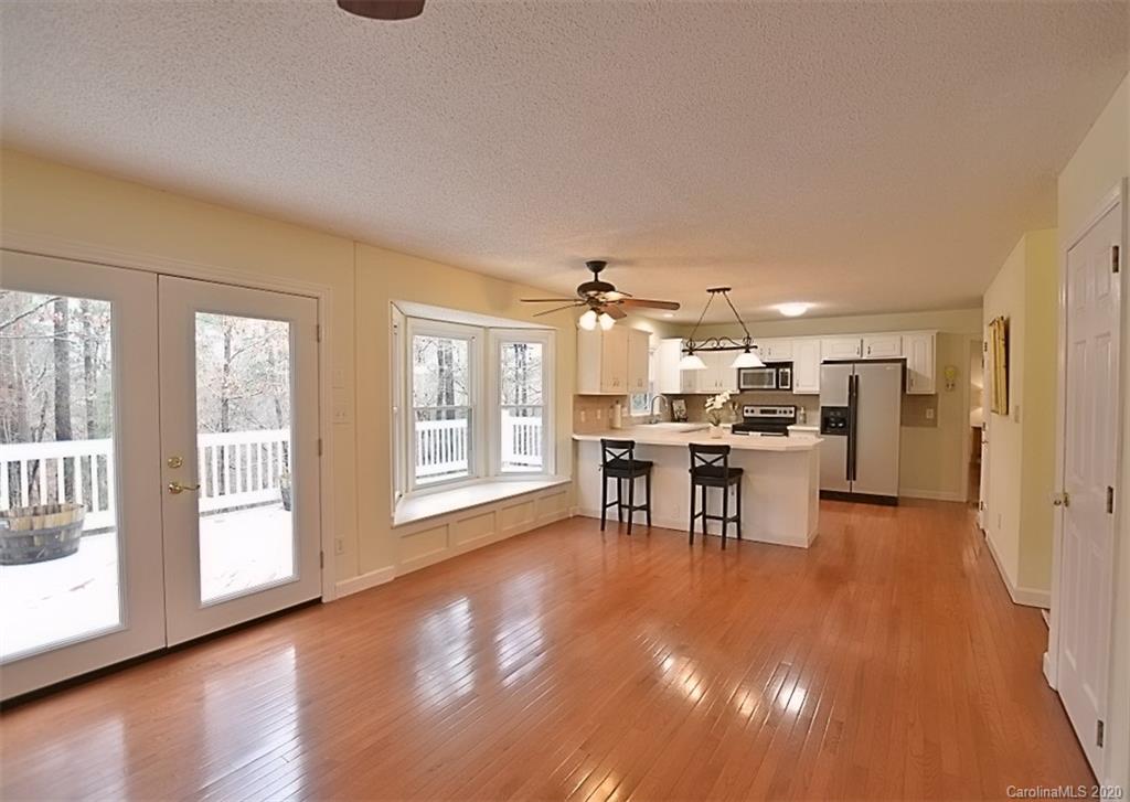 11068 Deep Cove Drive Tega Cay, SC 29708 - Photo 14 of 34 a living room with furniture and kitchen view
