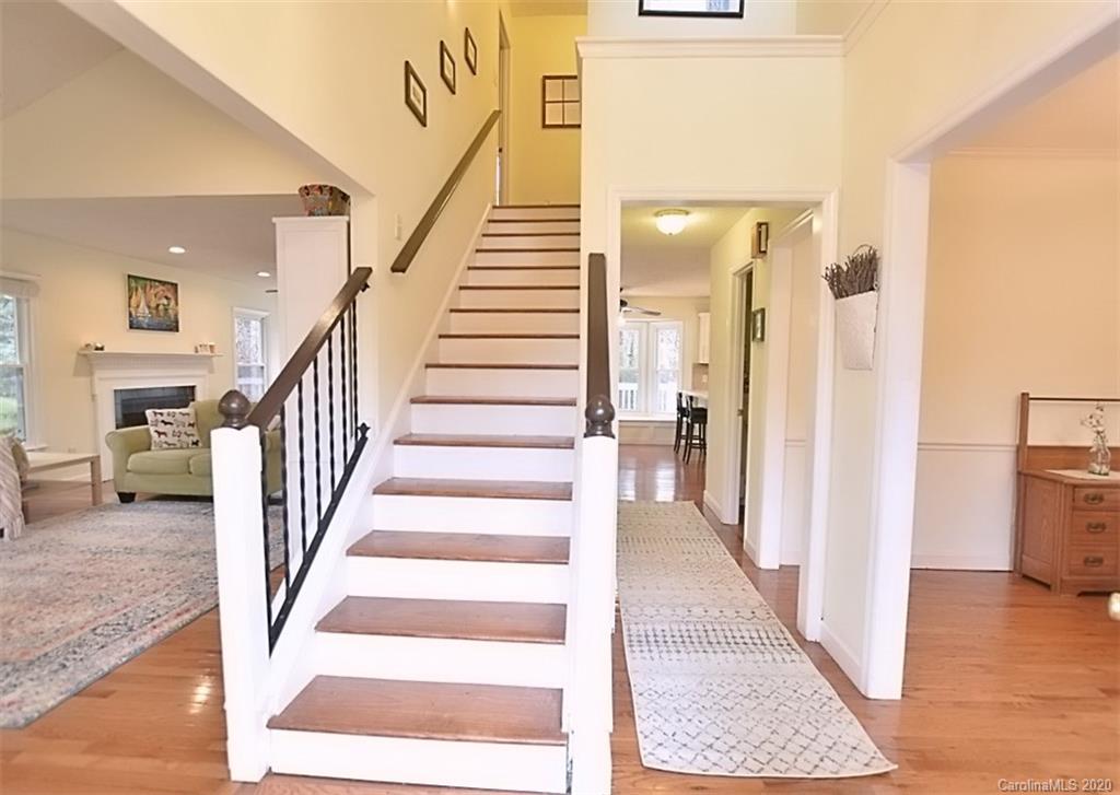 11068 Deep Cove Drive Tega Cay, SC 29708 - Photo 3 of 34 a view of an entryway with wooden floor and a livingroom view