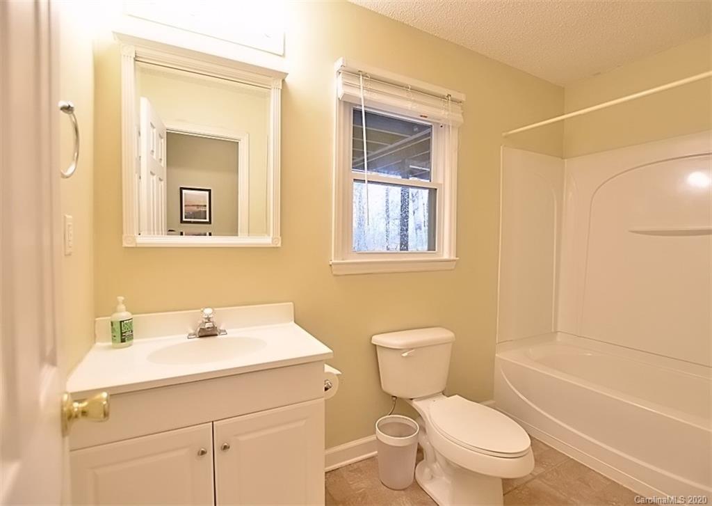 11068 Deep Cove Drive Tega Cay, SC 29708 - Photo 29 of 34 a bathroom with a sink toilet and shower