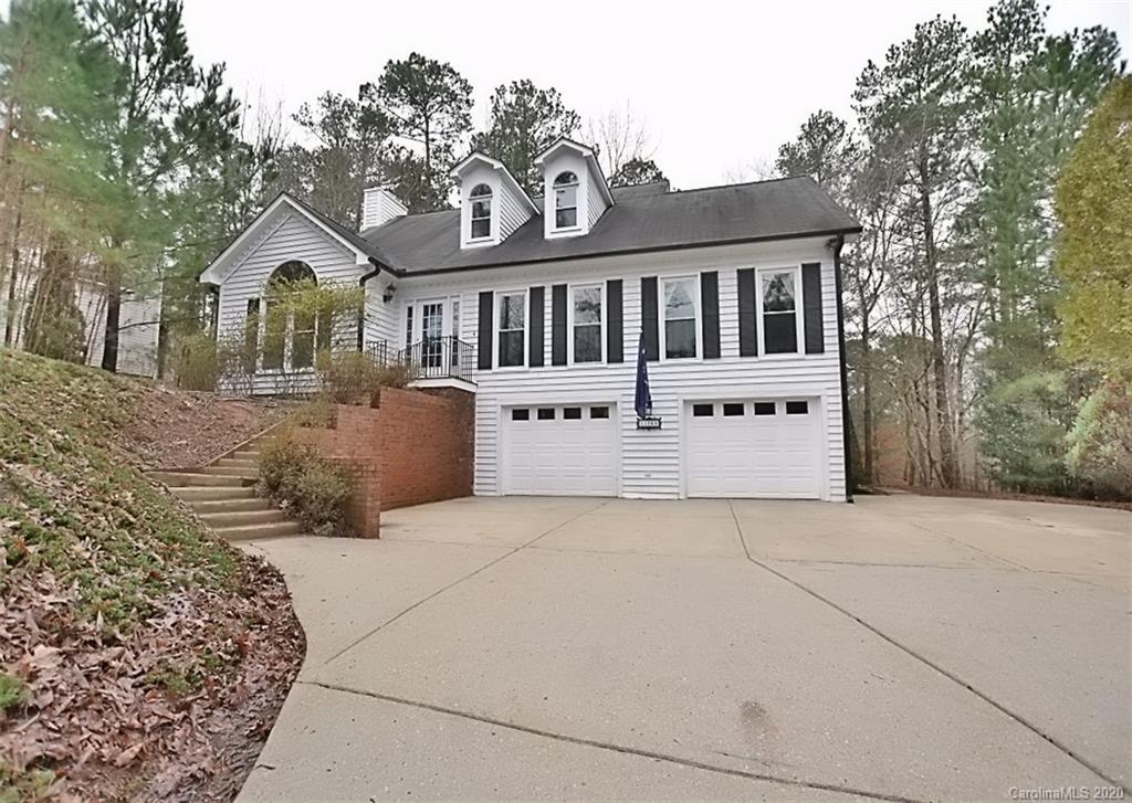 11068 Deep Cove Drive Tega Cay, SC 29708 - Photo 34 of 34 a front view of a house with a yard and garage