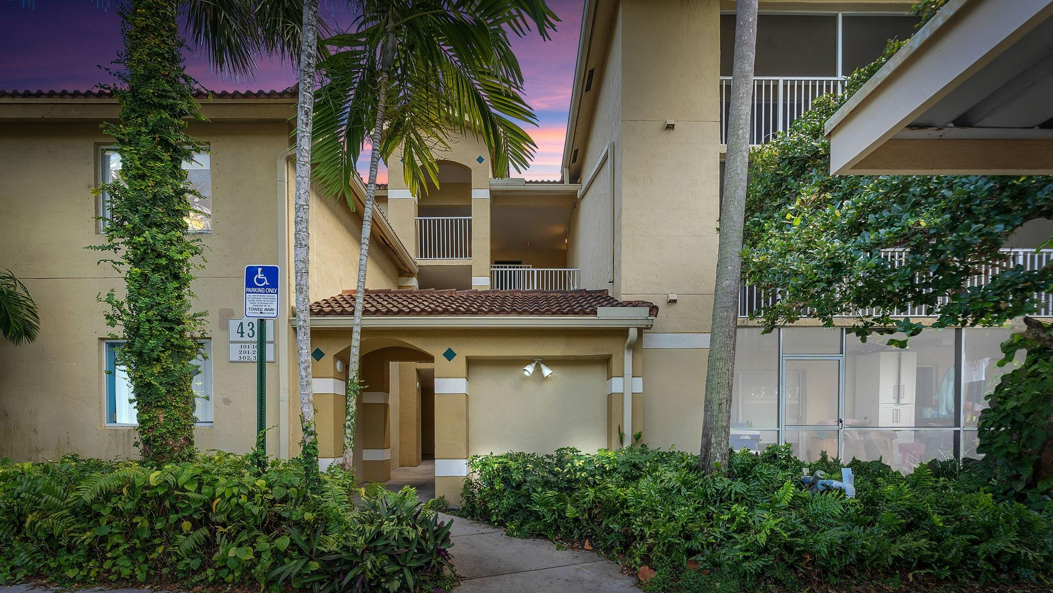 430 South Park Road, Unit 3303 Hollywood, FL 33021 - Photo 1 of 27 a front view of a house with a tree