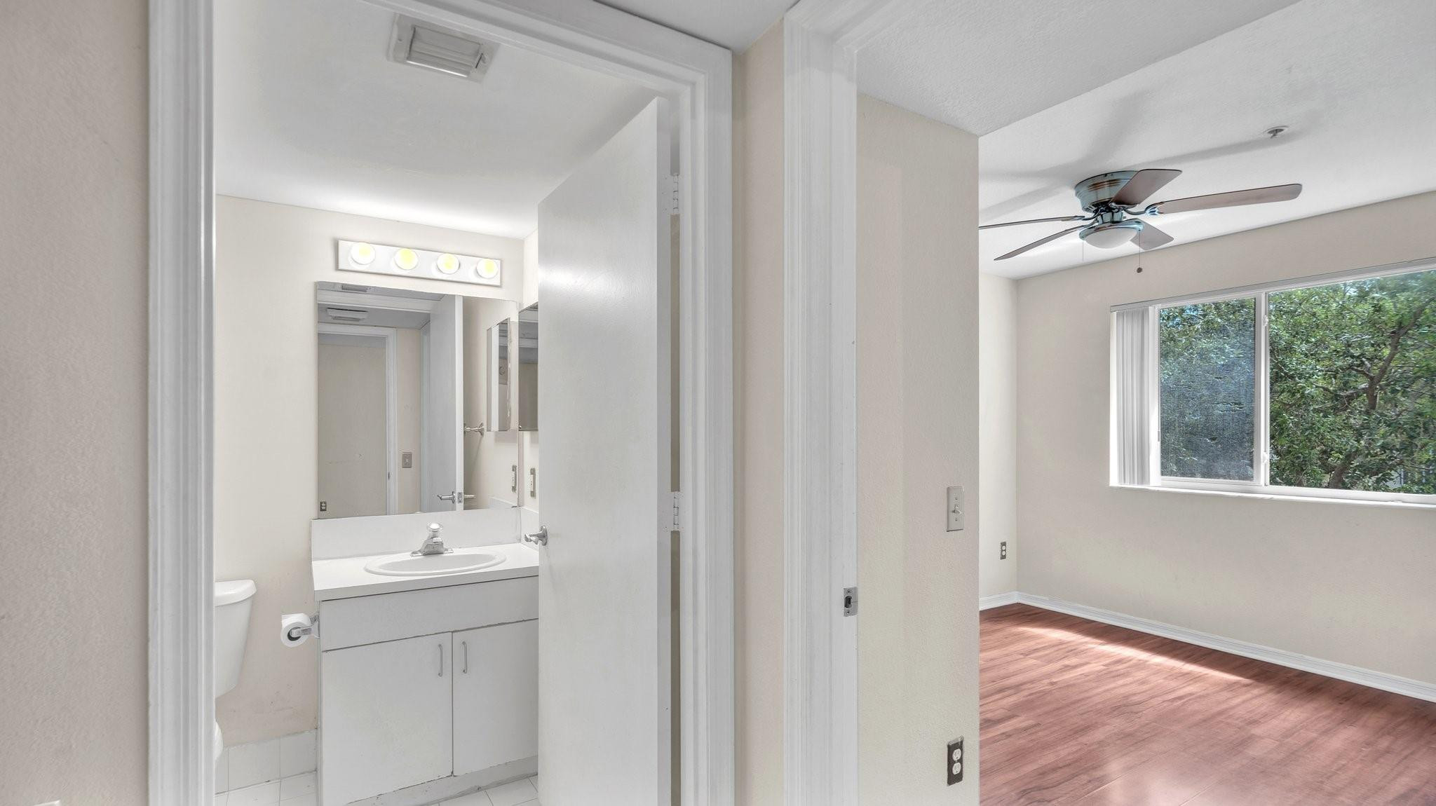 430 South Park Road, Unit 3303 Hollywood, FL 33021 - Photo 11 of 27 a bathroom with a sink a light fixture and a mirror