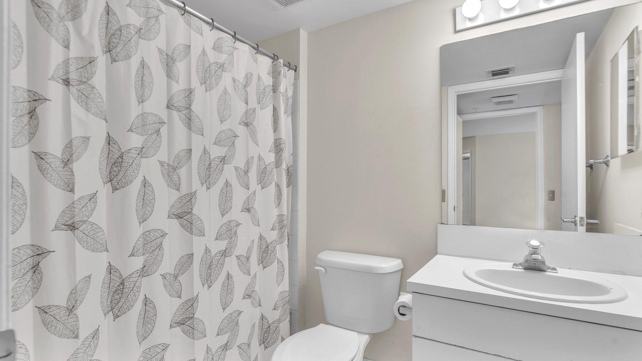 430 South Park Road, Unit 3303 Hollywood, FL 33021 - Photo 13 of 27 a bathroom with a toilet sink and mirror