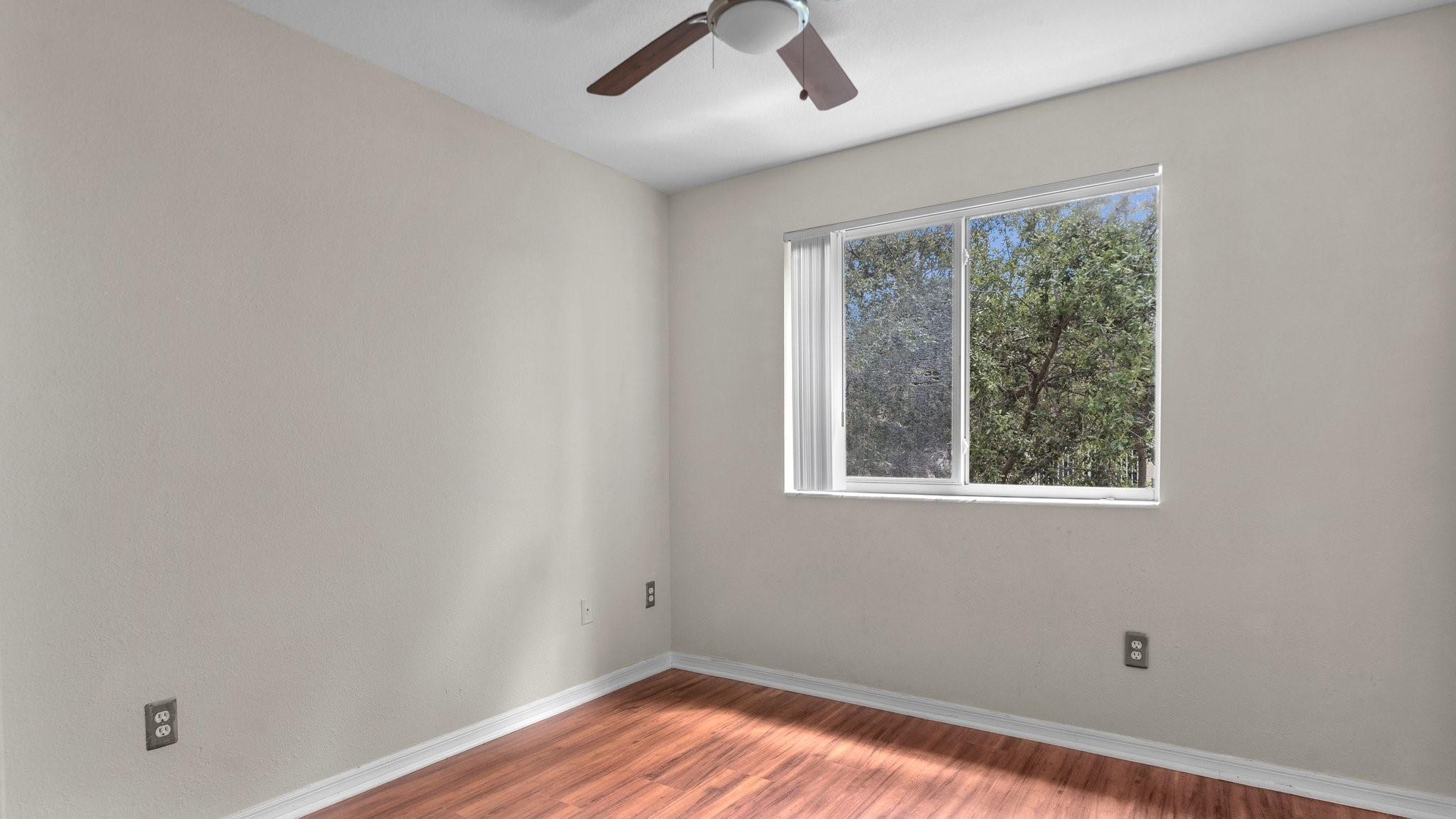 430 South Park Road, Unit 3303 Hollywood, FL 33021 - Photo 14 of 27 a view of empty room with wooden floor and fan