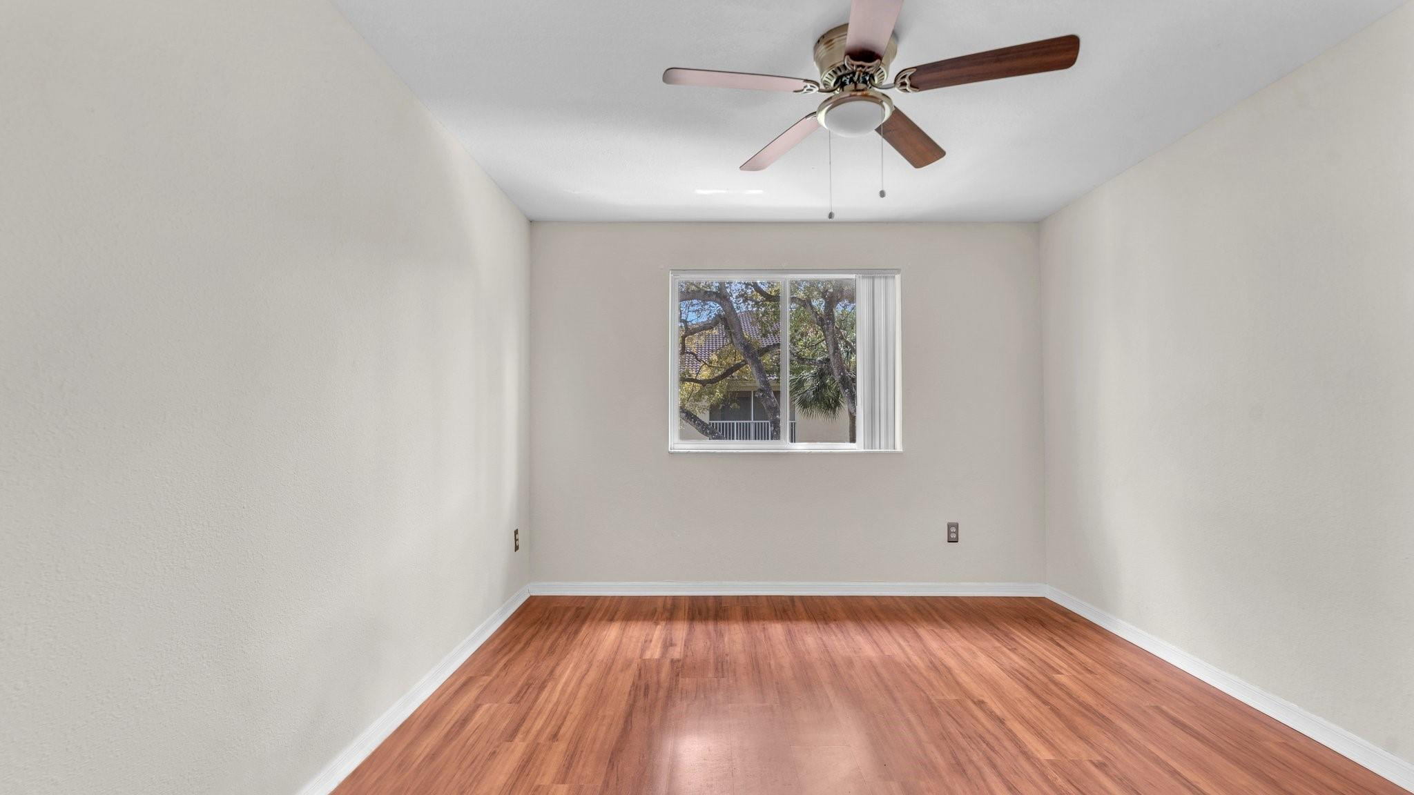 430 South Park Road, Unit 3303 Hollywood, FL 33021 - Photo 19 of 27 an empty room with a window and a ceiling fan